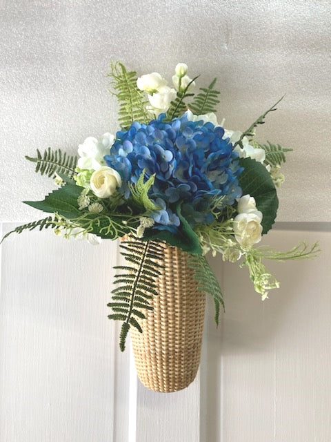 16"H x 14"W x 8D Nantucket Wall Basket with Bright Blue Hydrangea, White Ranunculus and  Fern Tips